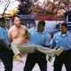 An inebriated Hitchens is forcibly removed from the Happy Trails trailer park.